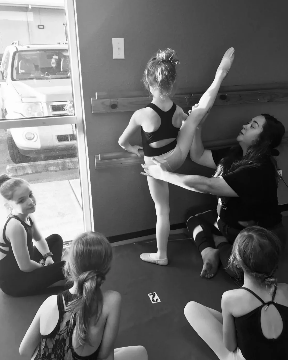 Fort Dance founder Brie working with a young dancer in the studio.